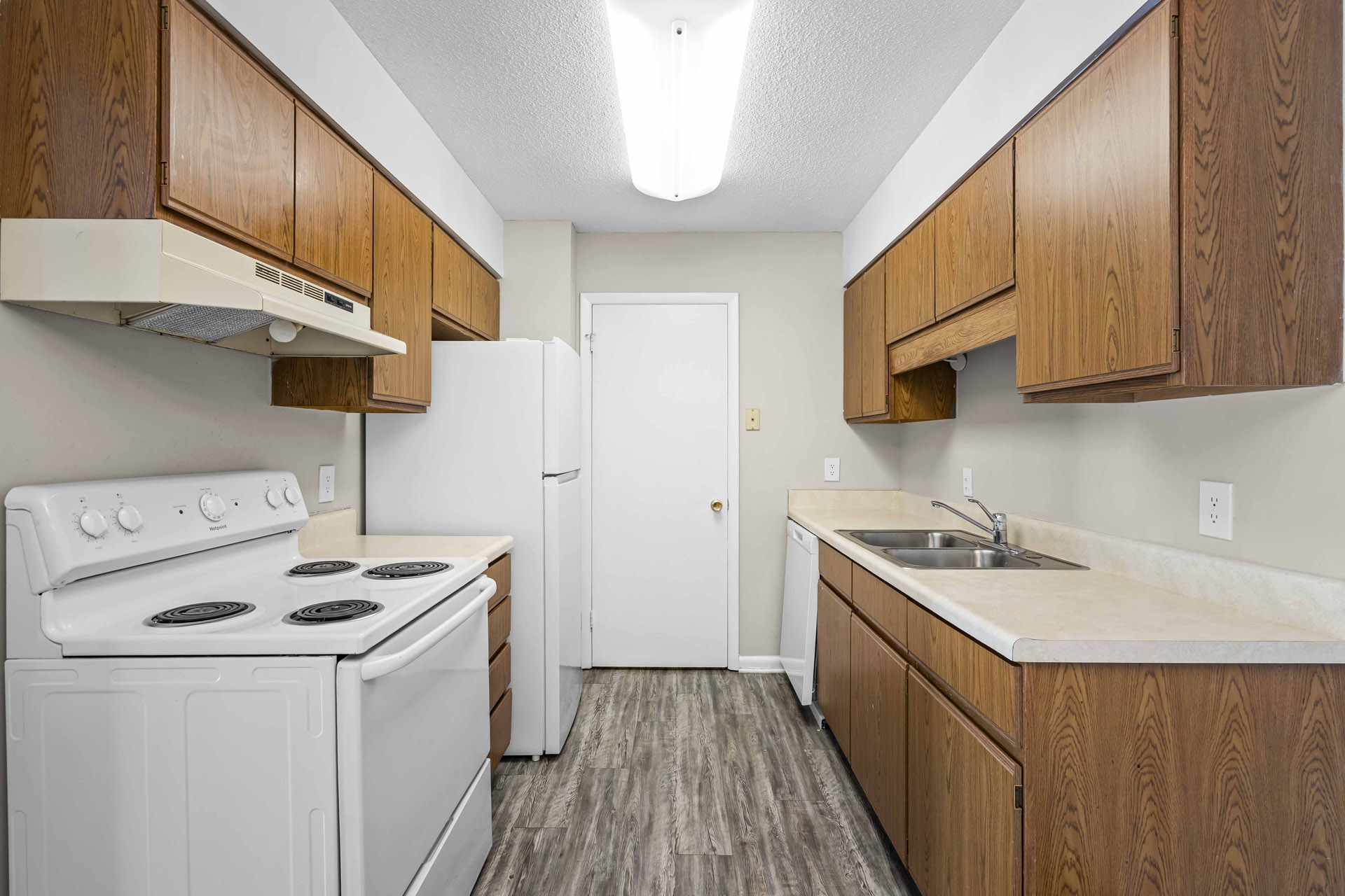Kitchen with Oak Cabinetry and white appliances